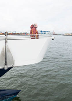James Connolly of Nahant braves the wind to enjoy the great views that the Lynn Ferry has to offer during its first trip of the year on Tuesday.