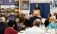 Mayor Judith Flanagan Kennedy addresses the crowd during her annual update to the Lynn Area Chamber of Commerce at the Porthole Restaurant on Friday.