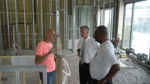 Restaurant owner Robert Rossetti, left, told City Council President Timothy Phelan and Councilor at large Gordon “Buzzy” Barton Monday he wants to help revive Lynn’s downtown.