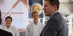 Congressman Seth Moulton talks with Chloe Merrithew and Josh Godman at the ribbon cutting celebrating the 20 million expansion at Kettle Cuisine. 