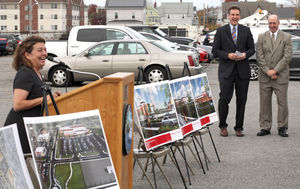 Mayor Judith Flanagan Kennedy speaks at the site of the old GE Factory of the Future on Friday as Secretary of Housing and Economic Development Jay Ash and Lynn Economic and Industrial Corporation Director James Cowdell listen.