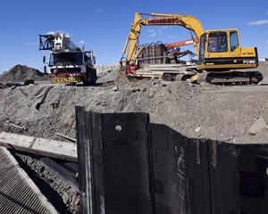 Work is seen under way Friday to build the pier for a future ferry landing at the end of Blossom Street extension off the Lynnway.